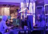 Best AI tools in 2026 Futuristic workspace with advanced AI assistants and interfaces